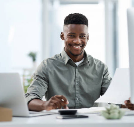 Man at computer happy in office